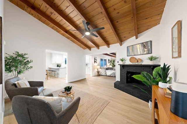 living room featuring a fireplace, light wood-style floors, wood ceiling, high vaulted ceiling, and beamed ceiling