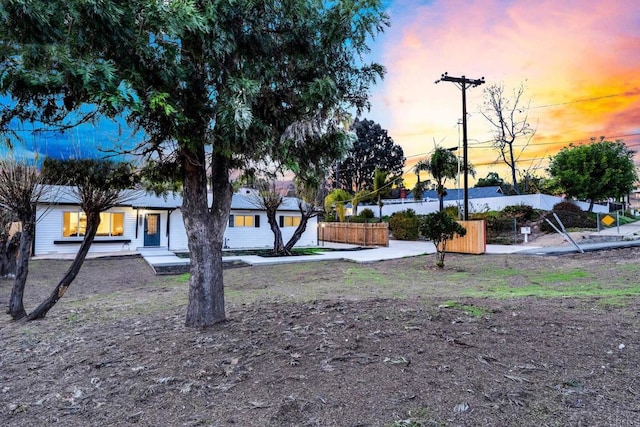 view of yard featuring fence and a patio