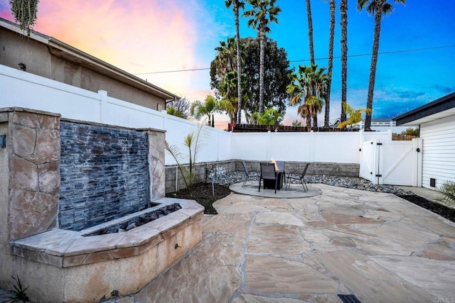 view of patio with a fenced backyard and a gate