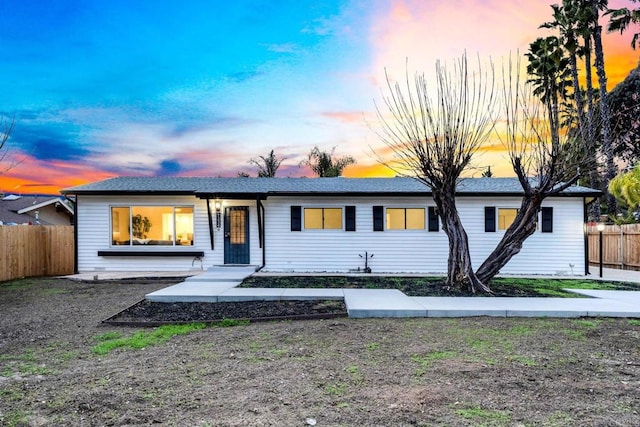 single story home with fence