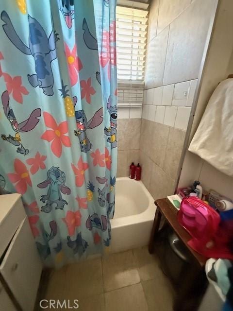 bathroom featuring shower / tub combo and tile patterned flooring