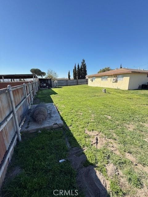 view of yard with a fenced backyard