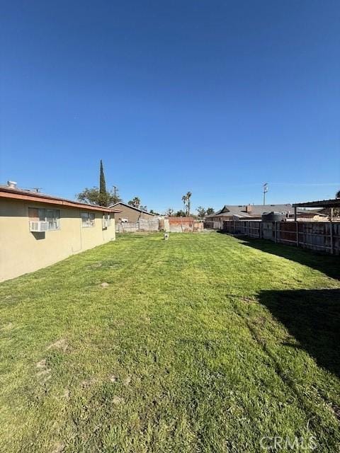 view of yard featuring a fenced backyard and a pergola