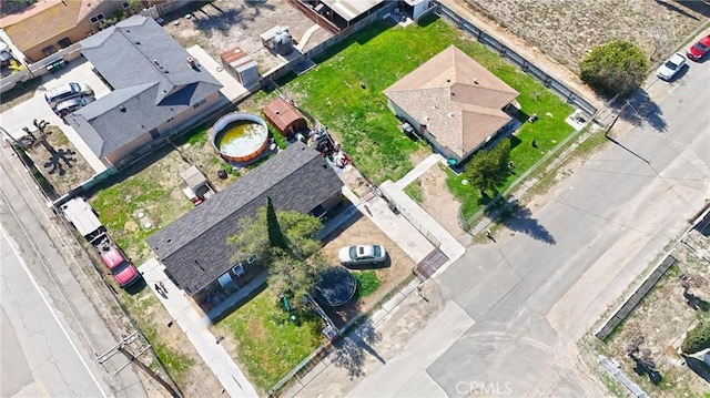 birds eye view of property with a residential view