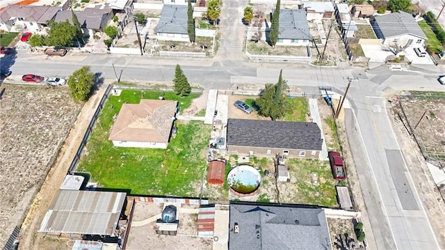 birds eye view of property with a residential view