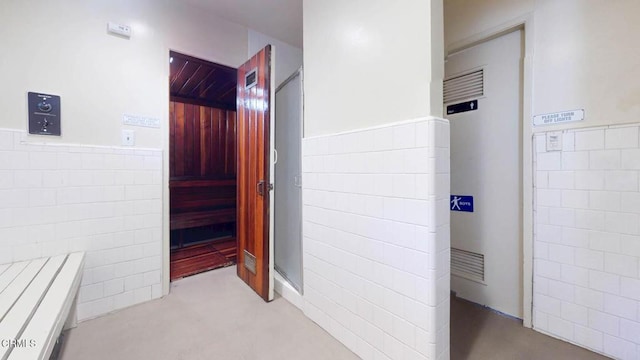 view of sauna with a wainscoted wall