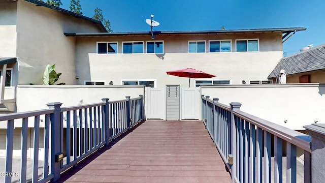 back of house featuring stucco siding