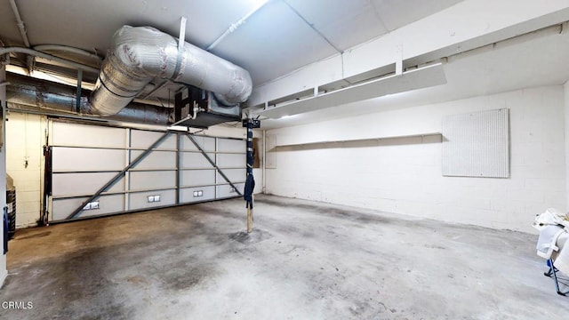 garage with concrete block wall