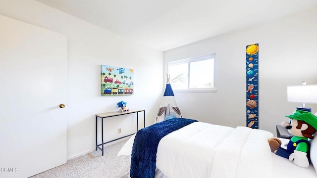 bedroom with light colored carpet