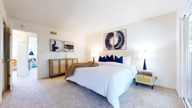 bedroom featuring carpet floors and visible vents