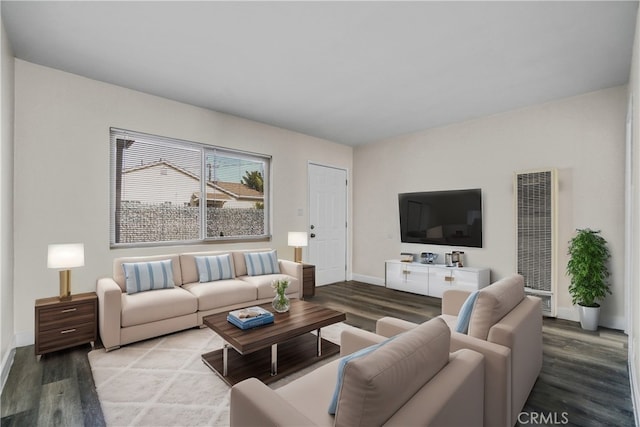 living area featuring wood finished floors and baseboards