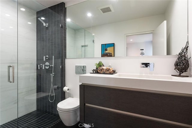 bathroom with visible vents, a shower stall, toilet, recessed lighting, and vanity