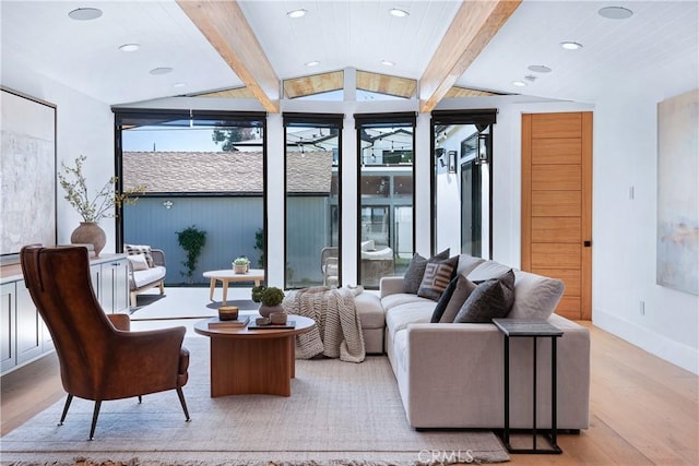 interior space with lofted ceiling with beams, recessed lighting, light wood-style flooring, and baseboards