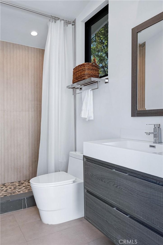 full bath with tile patterned flooring, toilet, a shower stall, and vanity