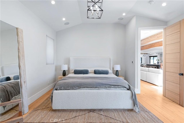 bedroom featuring recessed lighting, vaulted ceiling, baseboards, and wood finished floors