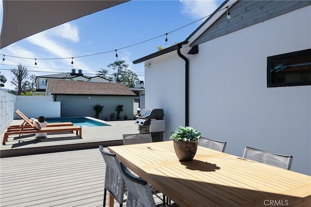 wooden terrace featuring a fenced in pool, visible vents, outdoor dining space, a grill, and fence