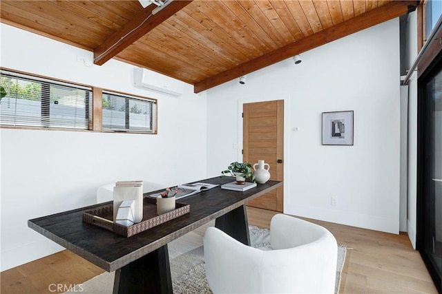 home office with lofted ceiling with beams, light wood-style flooring, a wall unit AC, and wood ceiling