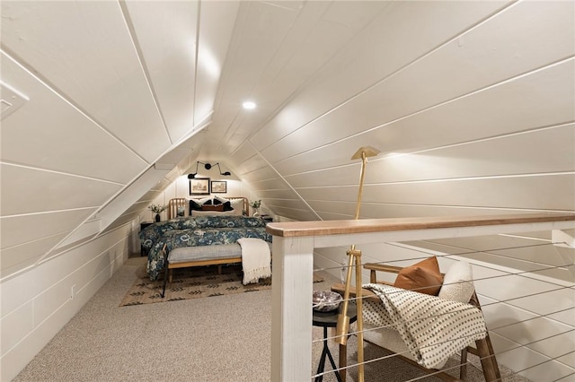 bedroom with vaulted ceiling and carpet