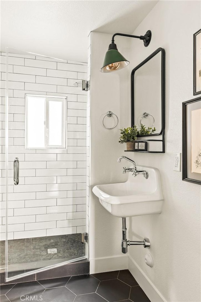 1149 Scenic Way, Rimforest, CA 92378 - bathroom with baseboards, tile patterned flooring, a shower stall, and a sink