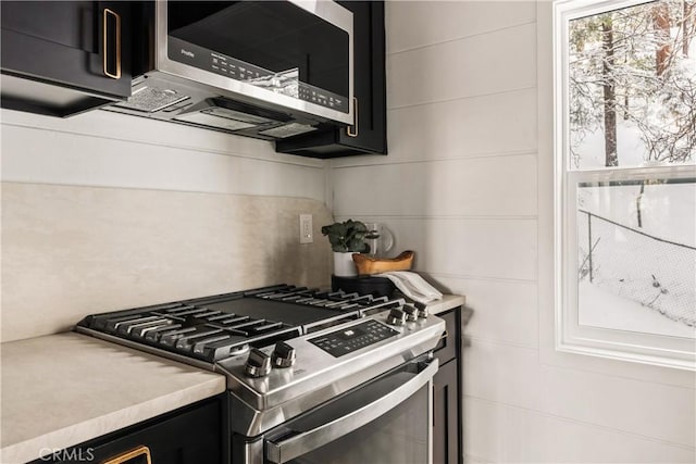 1149 Scenic Way, Rimforest, CA 92378 - kitchen featuring dark cabinetry, light countertops, and appliances with stainless steel finishes