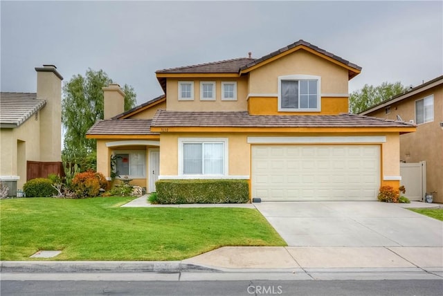 view of front of house featuring driveway, a chimney, fence, a front yard, and stucco siding