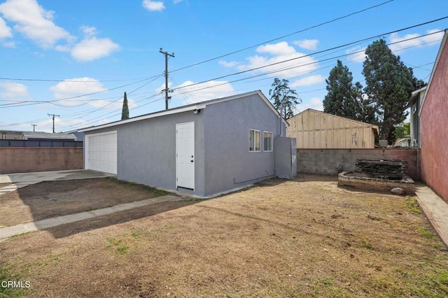 view of outbuilding with an outdoor structure and fence