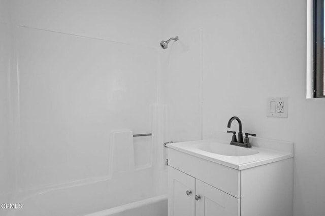 bathroom featuring shower / bathtub combination and vanity