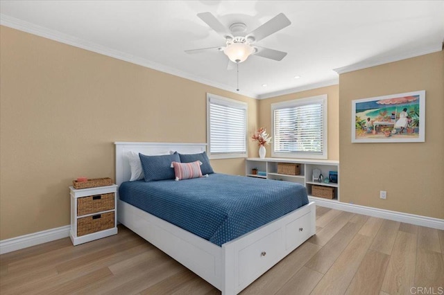 bedroom with baseboards, crown molding, a ceiling fan, and light wood-style floors