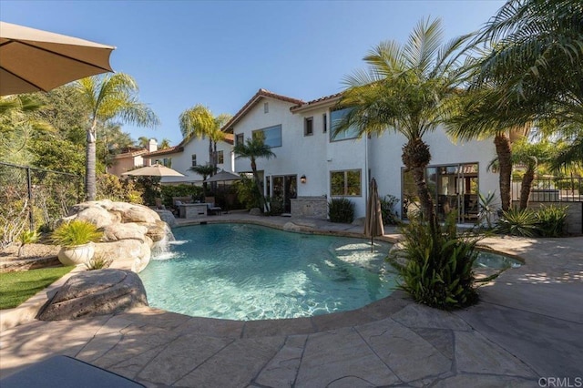 view of swimming pool with a patio area, fence, and a fenced in pool