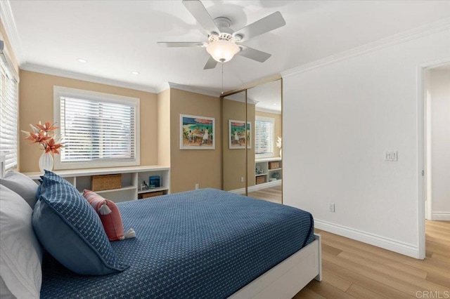 bedroom featuring recessed lighting, a ceiling fan, baseboards, ornamental molding, and light wood-type flooring