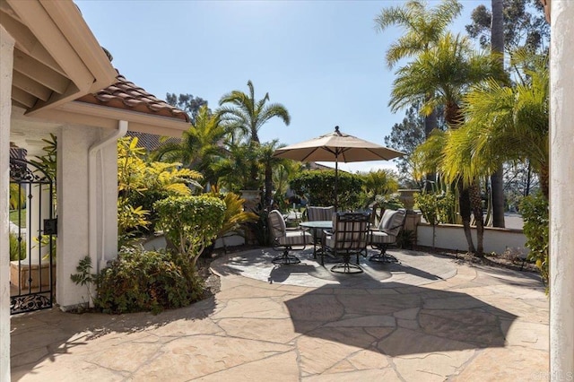 view of patio / terrace with outdoor dining area and fence