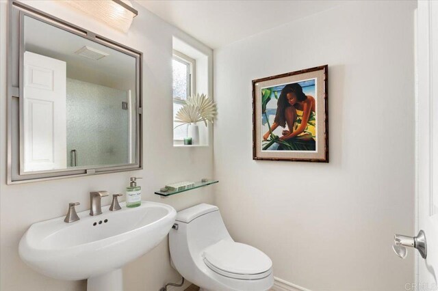 bathroom featuring a sink and toilet