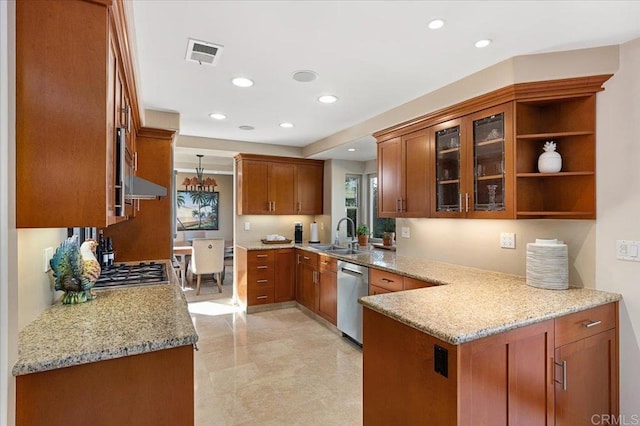 kitchen featuring brown cabinetry, pendant lighting, stainless steel dishwasher, and open shelves