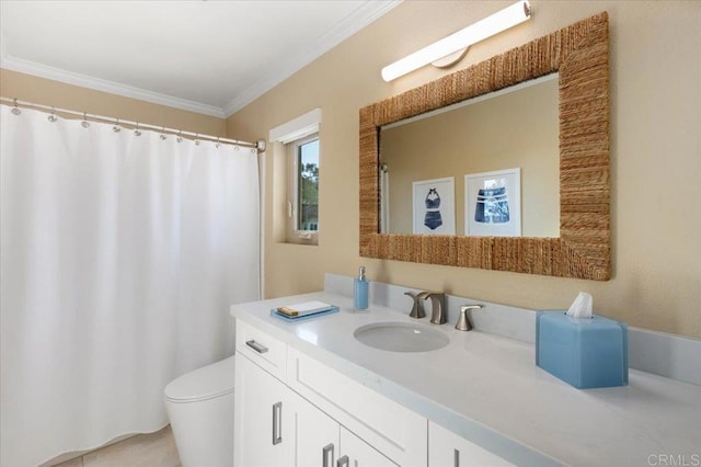 bathroom with toilet, vanity, and crown molding