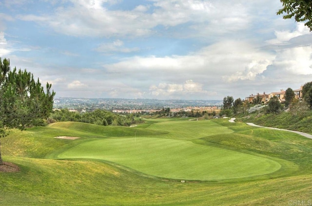 surrounding community with view of golf course