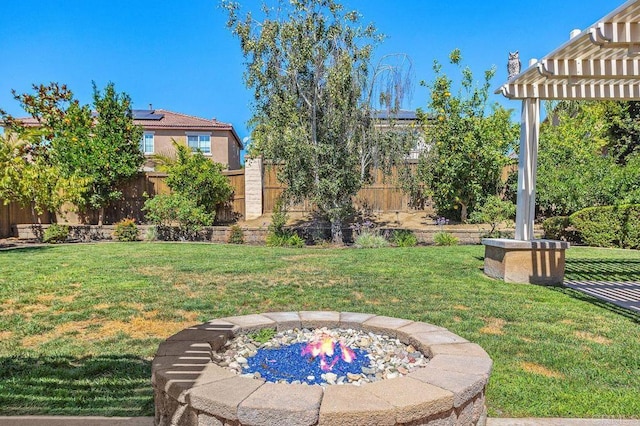 view of yard with fence and a pergola