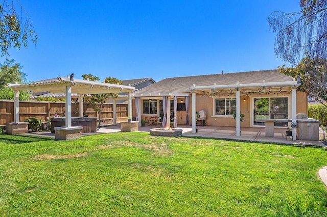 rear view of property with a patio, an outdoor fire pit, fence, stucco siding, and a pergola