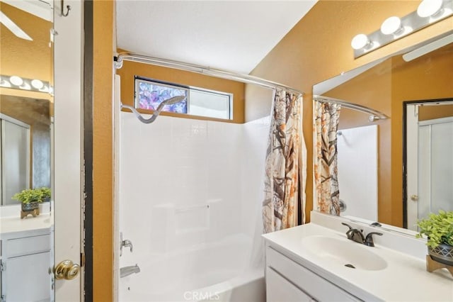 bathroom featuring shower / tub combo and vanity