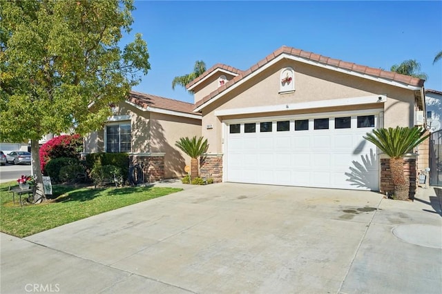 view of front of house with a garage, stone siding, concrete driveway, and stucco siding