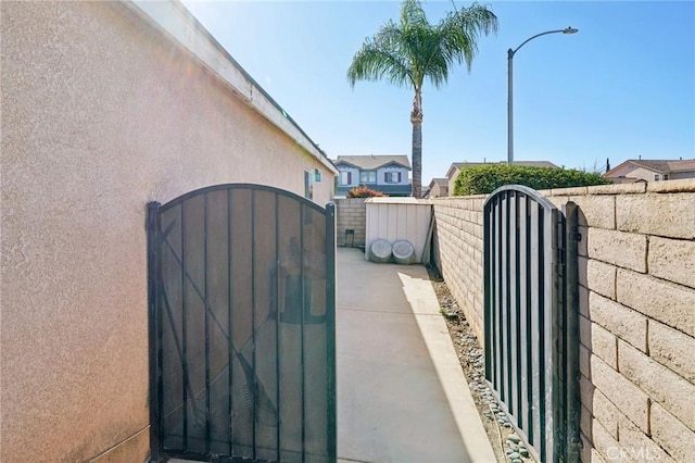 view of gate with fence