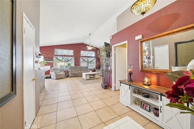 interior space with vaulted ceiling and light tile patterned flooring