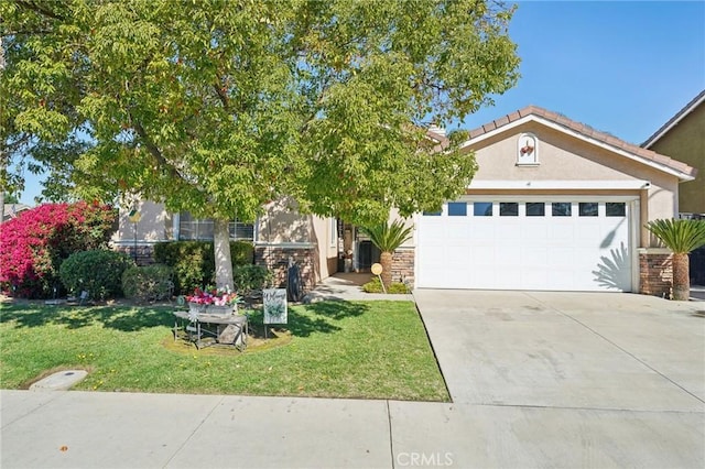 view of front of property with concrete driveway, stone siding, an attached garage, a front lawn, and stucco siding