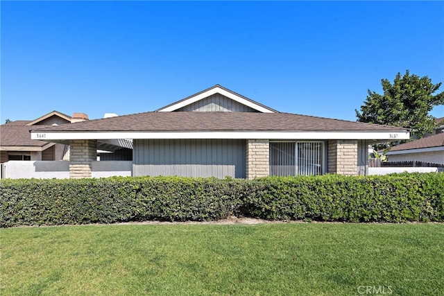 view of home's exterior with a yard and brick siding