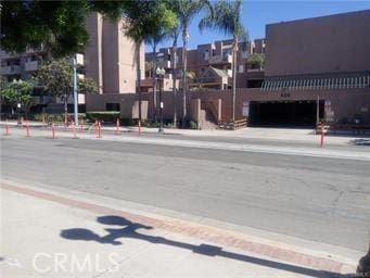 view of road featuring curbs and sidewalks