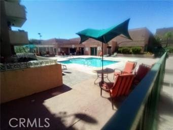 pool featuring a patio area