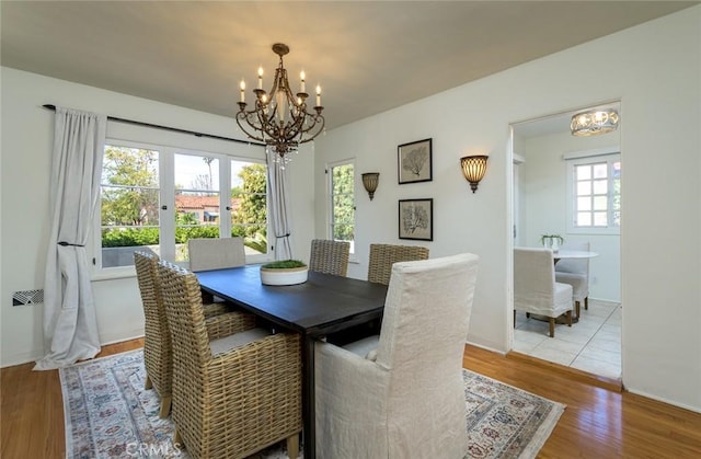 dining room featuring a chandelier and wood finished floors