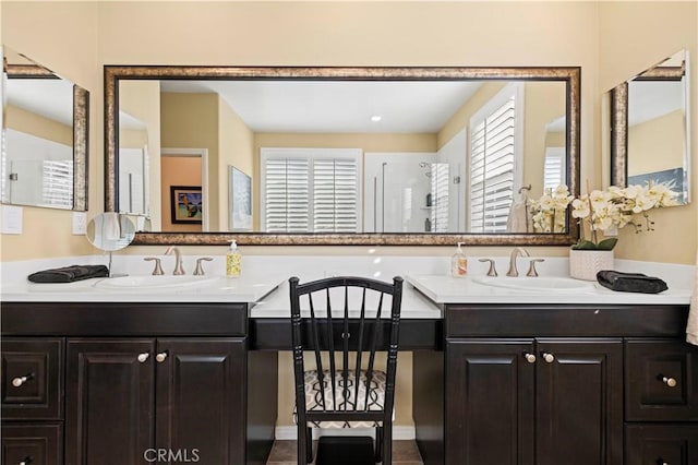 bathroom featuring double vanity and a sink