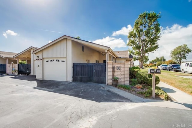 view of front of house featuring a garage and fence