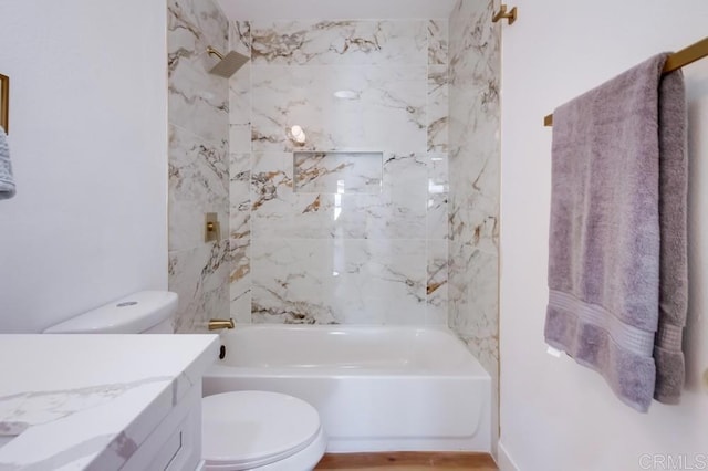 full bathroom featuring toilet, shower / washtub combination, and vanity