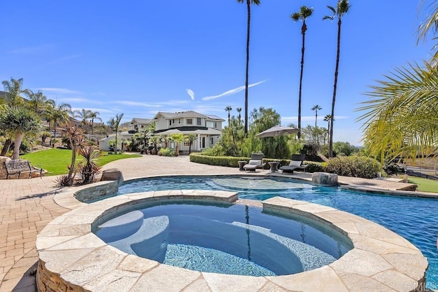 view of swimming pool with a pool with connected hot tub